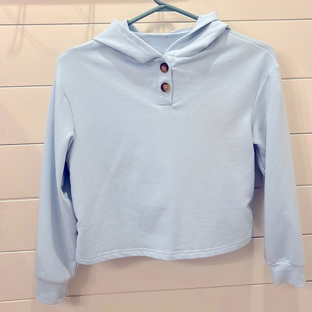 Youth Medium, hooded long sleeve, with two usable buttons at the neck line.